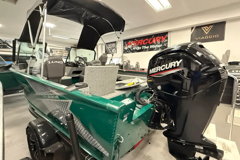 Slide: The Image of 2026 Lund 1775 Adventure Sport boat with Mercury engine in showroom. - 12