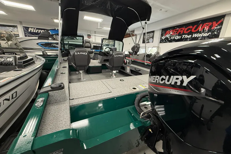 Slide: The Image of 2026 Lund 1775 Adventure Sport boat with Mercury engine in showroom. - 3