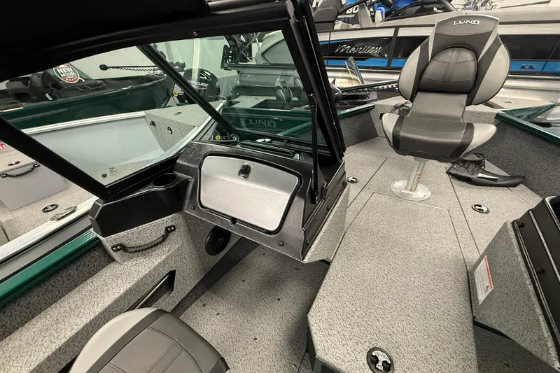Slide: The Image of 2026 Lund 1775 Adventure Sport boat interior with seating and storage compartments. - 7