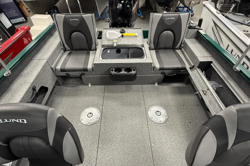 Slide: The Image of 2026 Lund 1775 Adventure Sport boat interior with seating and storage compartments. - 9