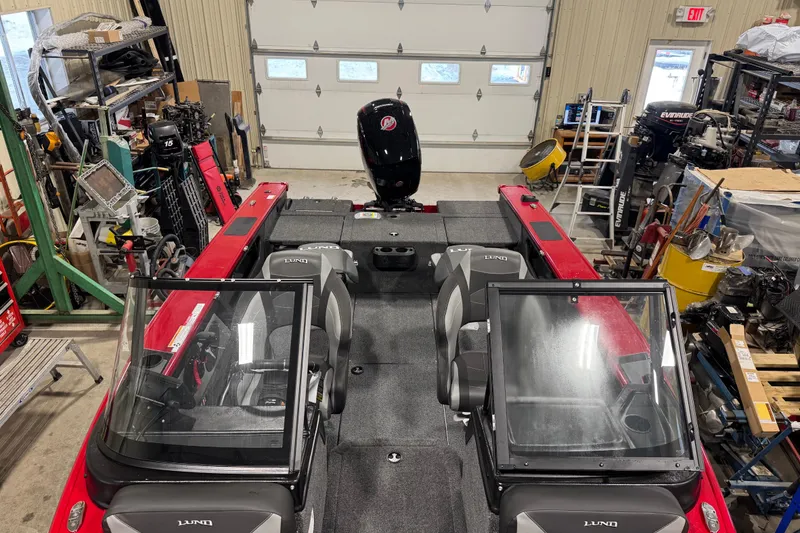 Slide: The Image of 2026 Lund Crossover XS 1875 boat interior with seating and storage compartments. - 6