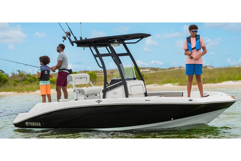 Slide: The Image of 2023 Yamaha Boats 190 FSH Sport with family fishing near shore. - 6
