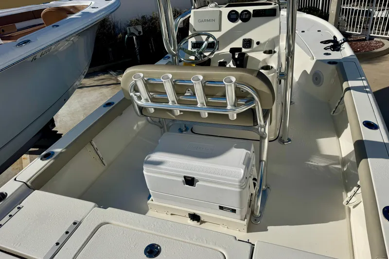Slide: The Image of 2023 Key West 210 Bay Reef boat interior with Garmin system and cooler. - 23