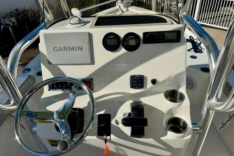 Slide: The Image of 2023 Key West 210 Bay Reef boat console with Garmin navigation system and controls. - 28