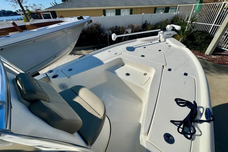 Slide: The Image of 2023 Key West 210 Bay Reef boat with seating and storage compartments. - 32
