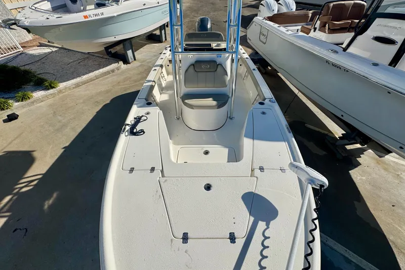 Slide: The Image of 2023 Key West 210 Bay Reef boat, top view, docked alongside other boats. - 36