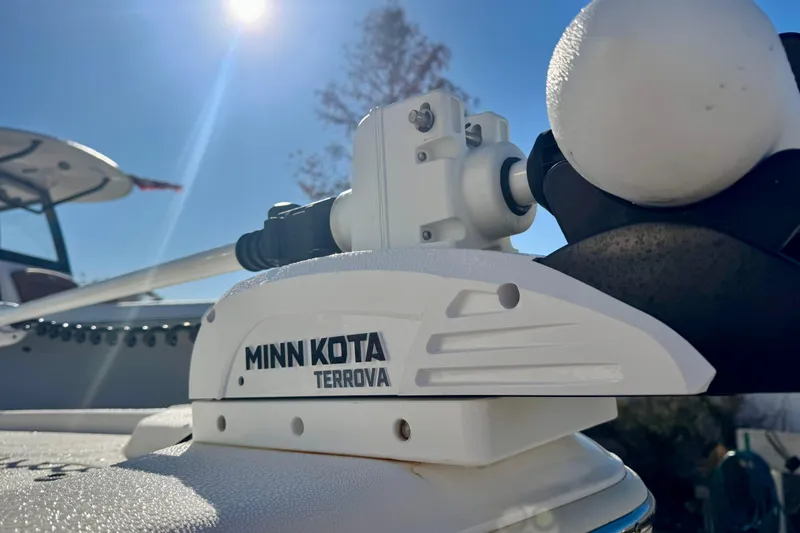 Slide: The Image of Minn Kota Terrova motor on 2023 Key West 210 Bay Reef boat under sunny sky. - 4