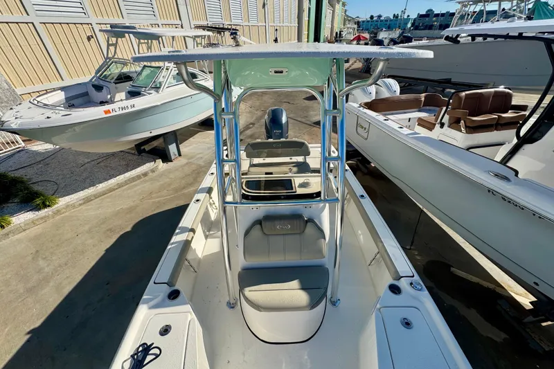 Slide: The Image of 2023 Key West 210 Bay Reef boat, top view, docked among other boats. - 40