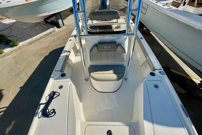 Slide: The Image of 2023 Key West 210 Bay Reef boat interior with seating and storage compartments. - 41