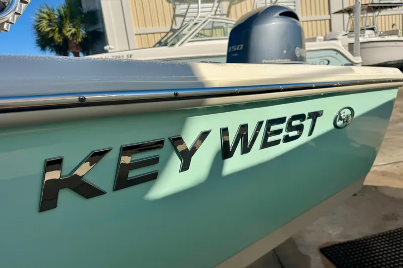 Slide: The Image of 2023 Key West 210 Bay Reef boat with Yamaha engine, side view. - 9