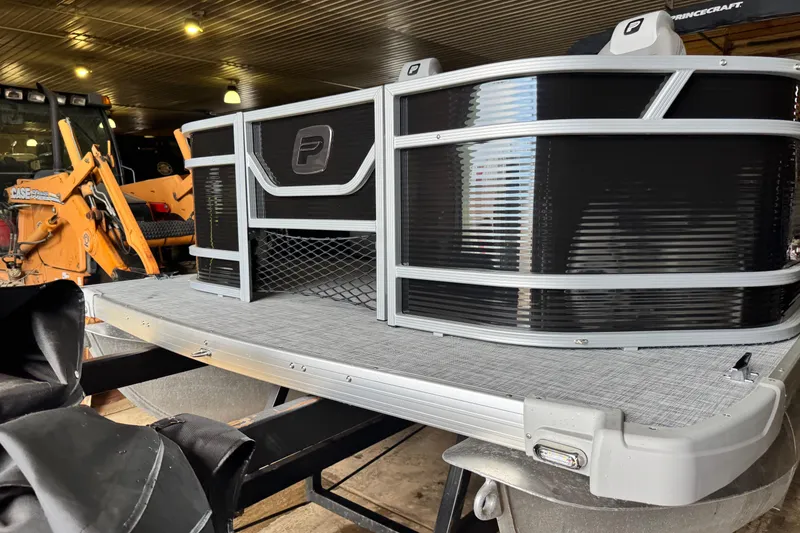 Slide: The Image of 2026 Princecraft Sportfisher 23-2S RL pontoon boat in a garage setting. - 18