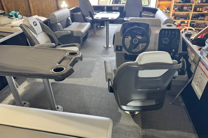 Slide: The Image of Interior of 2026 Princecraft Sportfisher 23-2S RL boat with seating and steering console. - 5