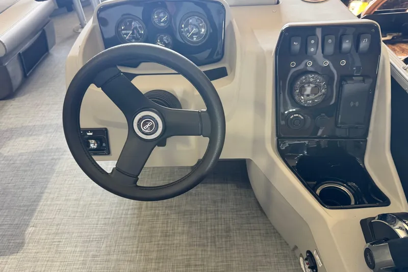 Slide: The Image of Steering console of 2026 Princecraft Sportfisher 23-2S RL boat with control panel. - 6