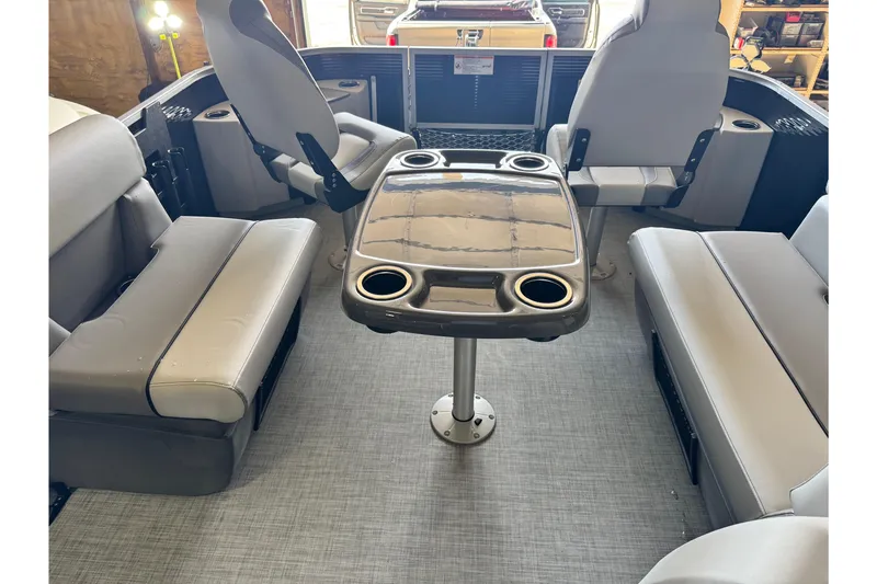 Slide: The Image of Interior of 2026 Princecraft Sportfisher 23-2S RL boat with seating and table. - 7