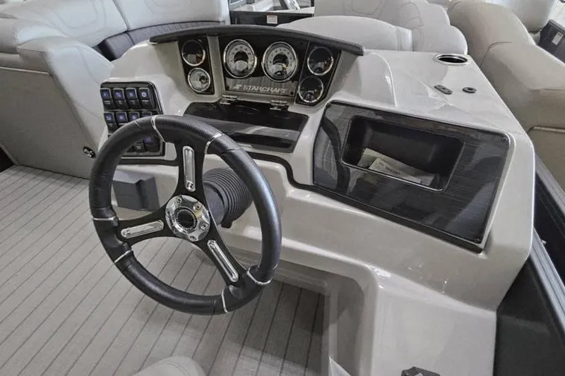 Slide: The Image of 2024 Starcraft SLS 3 boat dashboard with steering wheel and control panel. - 6