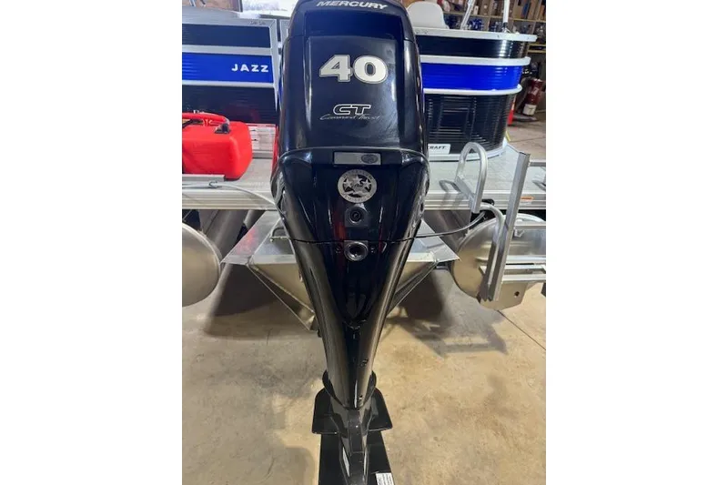 Slide: The Image of 2026 Princecraft Jazz 170 with Mercury 40 HP outboard motor in a garage setting. - 10