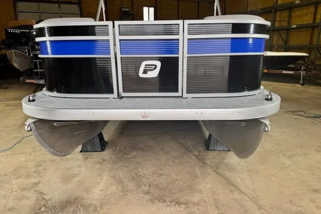 The Image of 2026 Princecraft Jazz 170 pontoon boat in a garage, featuring sleek black and blue design. - 2