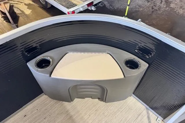 Slide: The Image of 2026 Princecraft Jazz 190-4S boat interior with cup holders and sleek design. - 7