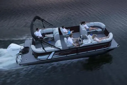 Slide: The Image of Manufacturer Provided Image: 2024 Starcraft SLS 3 pontoon boat cruising on water with passengers. - 6