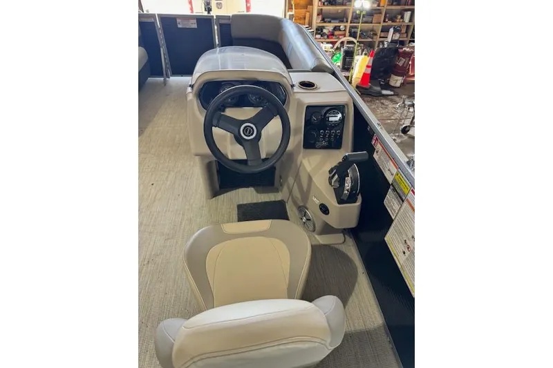 Slide: The Image of Interior view of 2026 Princecraft Jazz 210-2S boat cockpit with steering wheel and controls. - 10