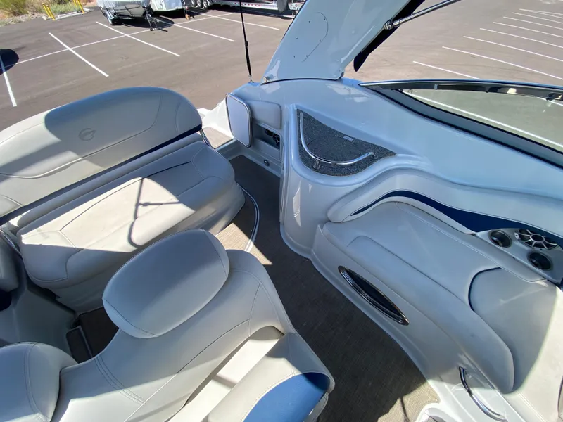 Slide: The Image of Interior of 2022 Crownline 264 CR boat with white seating and modern design. - 14