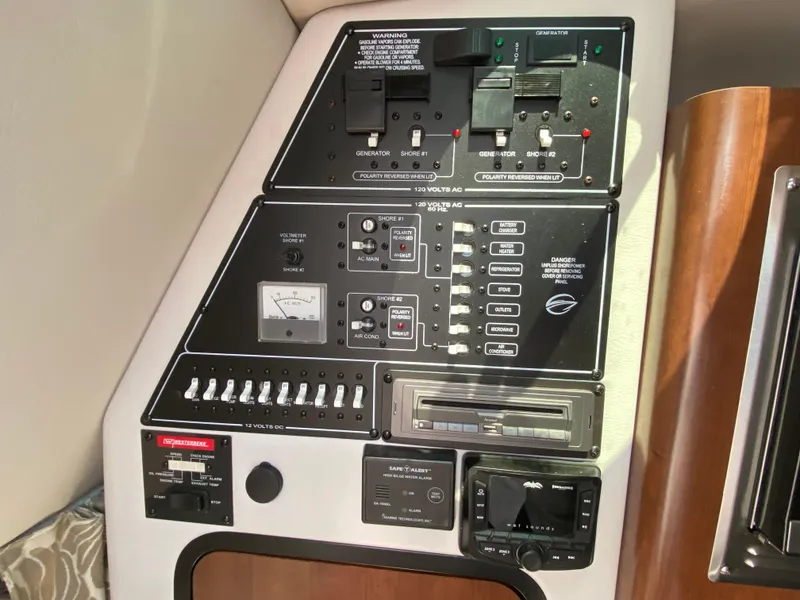 Slide: The Image of Control panel of 2022 Crownline 264 CR boat with various switches and gauges. - 18