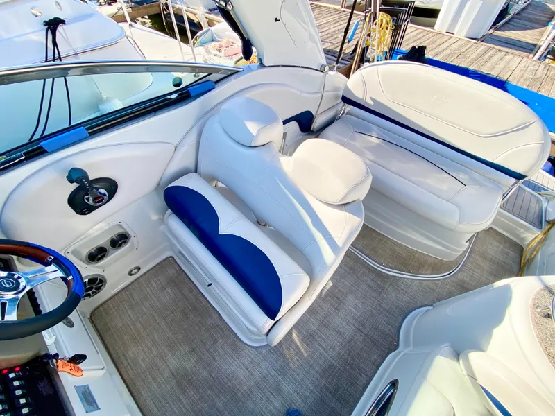 Slide: The Image of 2022 Crownline 264 CR boat interior with white and blue seating. - 30