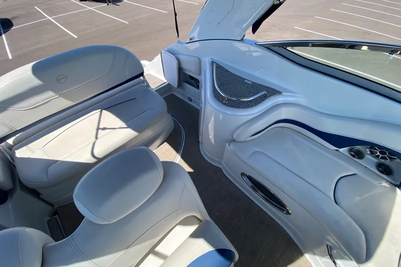 Slide: The Image of Interior of 2022 Crownline 264 CR boat with white seating and modern design. - 46