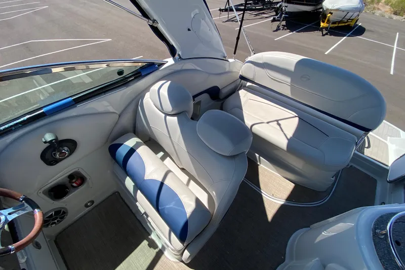 Slide: The Image of 2022 Crownline 264 CR boat interior with plush seating and modern design. - 47