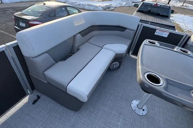 Slide: The Image of 2026 Princecraft Vectra 21 RL pontoon boat interior with gray seating and table. - 12