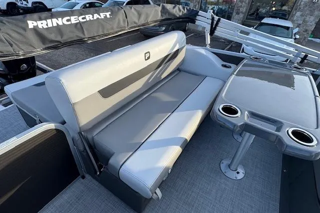 Slide: The Image of 2026 Princecraft Vectra 21 RL boat interior with gray seating and table. - 15