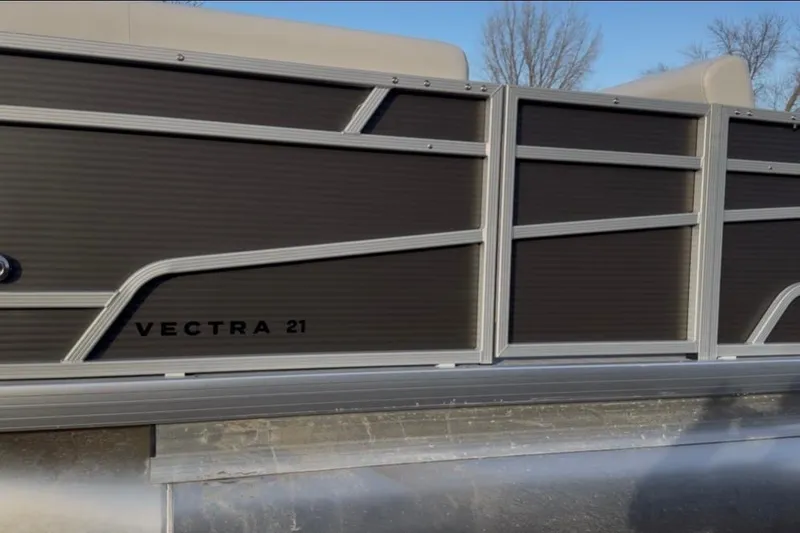 Slide: The Image of 2026 Princecraft Vectra 21 RL pontoon boat side view with sleek design. - 4