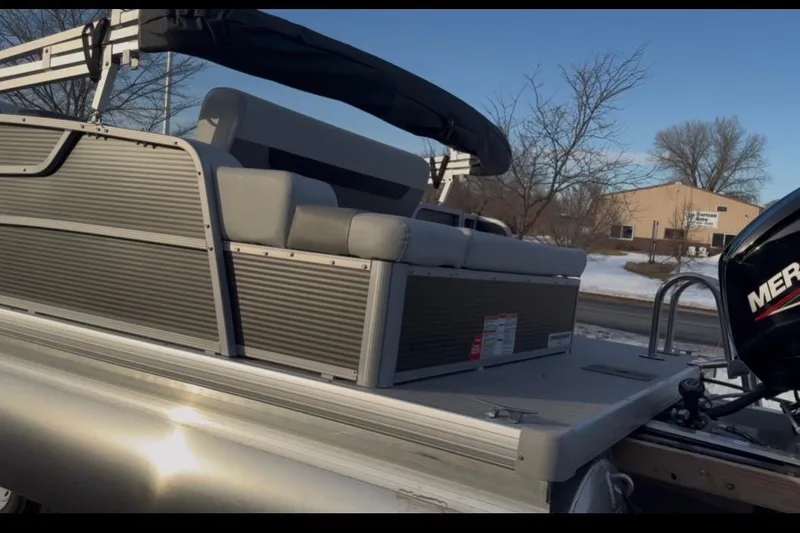 Slide: The Image of 2026 Princecraft Vectra 21 RL pontoon boat with Mercury engine, parked in snowy setting. - 5