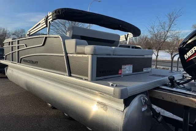 Slide: The Image of 2026 Princecraft Vectra 21 RL pontoon boat with canopy, parked outdoors. - 6