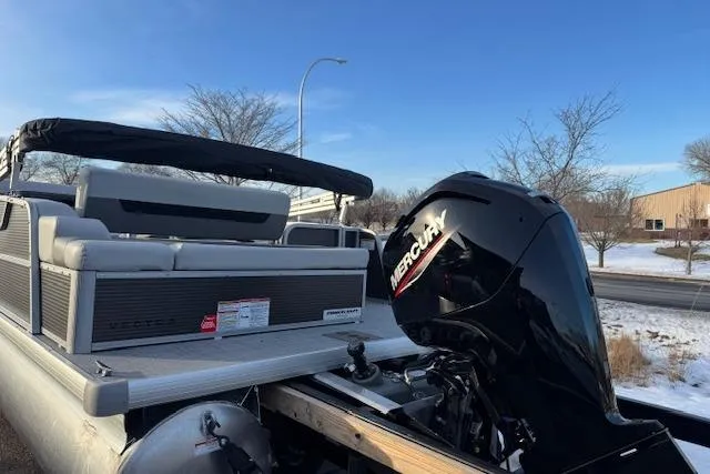 Slide: The Image of 2026 Princecraft Vectra 21 RL pontoon boat with Mercury engine, parked outdoors. - 7