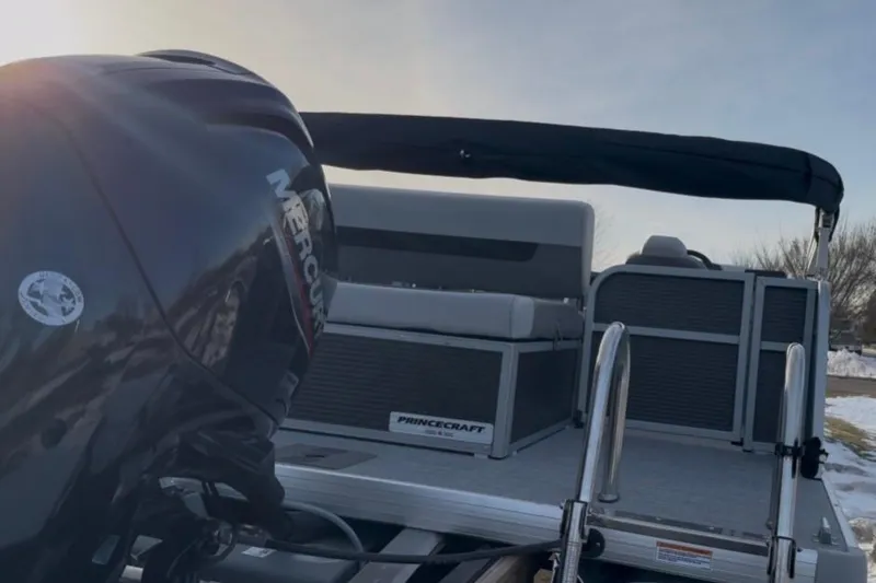 Slide: The Image of 2026 Princecraft Vectra 21 RL pontoon boat with Mercury engine, rear view. - 8