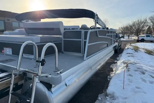 Slide: The Image of 2026 Princecraft Vectra 21 RL pontoon boat with ladder, parked on snowy ground. - 9