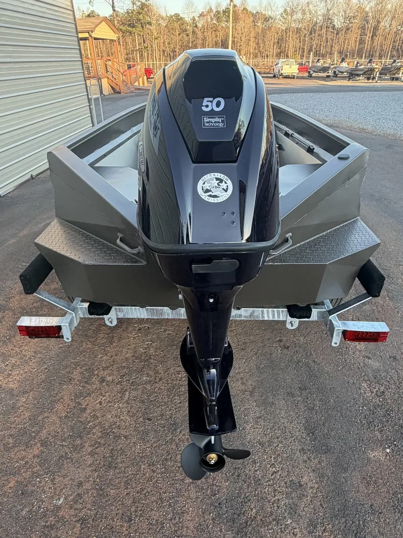 Slide: The Image of 2026 Edge Duck Boats Sportsman Series 656 with outboard motor. - 14