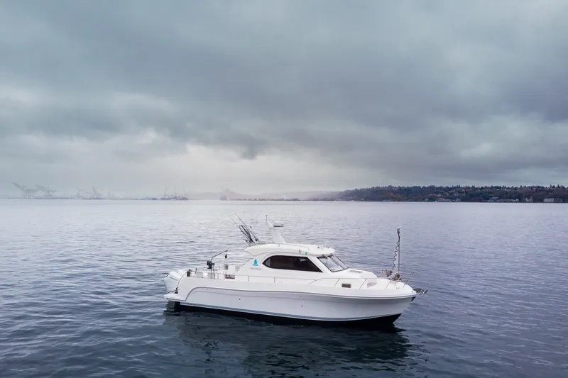 The Image of 2025 Bracewell Commander 36SF yacht on calm waters under cloudy skies. - 0