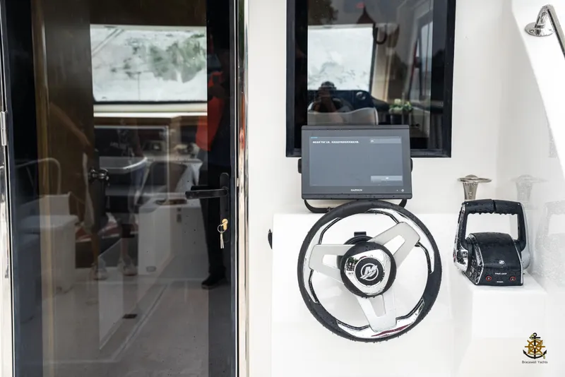 Slide: The Image of Interior of 2025 Bracewell Commander 36SF yacht with steering wheel and control panel. - 10
