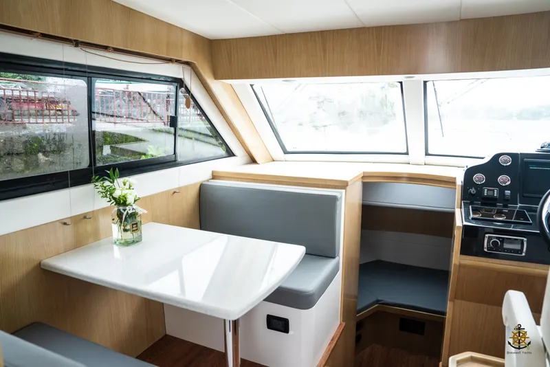 Slide: The Image of Interior of 2025 Bracewell Commander 36SF yacht with modern seating and helm. - 12