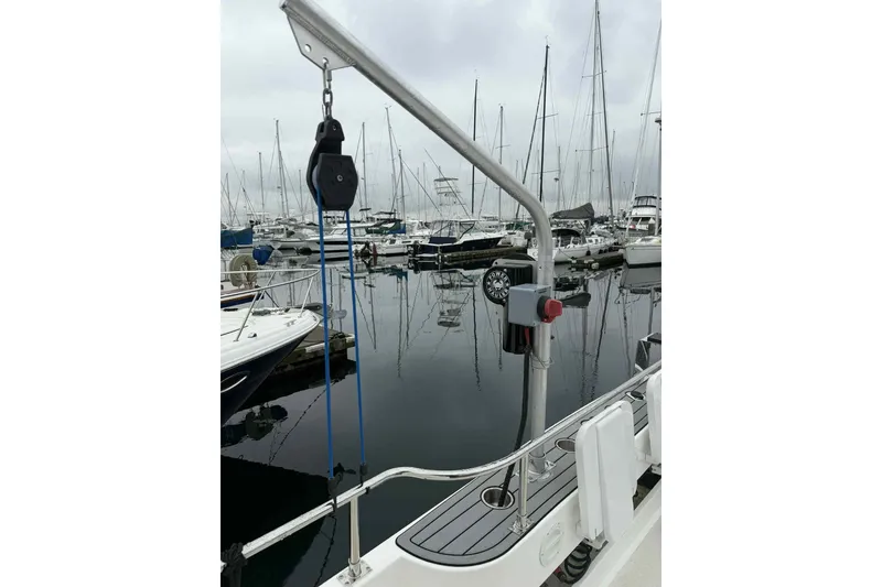 Slide: The Image of 2025 Bracewell Commander 36SF yacht at marina, featuring deck equipment and moored boats. - 24