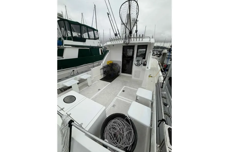 Slide: The Image of 2025 Bracewell Commander 36SF boat deck with fishing gear and seating. - 9