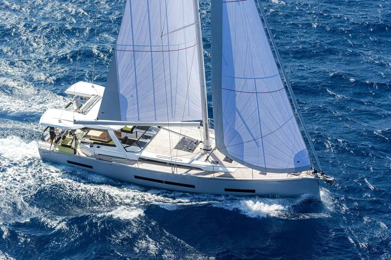 Slide: The Image of Sailing yacht Hanse 590, 2026 model, cruising on open sea with full sails. - 31