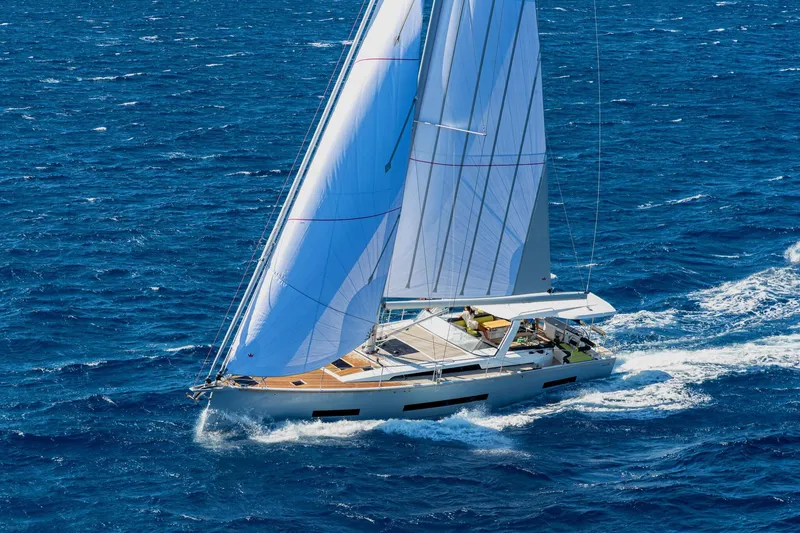 Slide: The Image of Sailing yacht Hanse 590, 2026 model, cruising on open blue sea. - 34