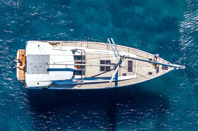 Slide: The Image of Aerial view of 2026 Hanse 590 yacht on clear blue water. - 4