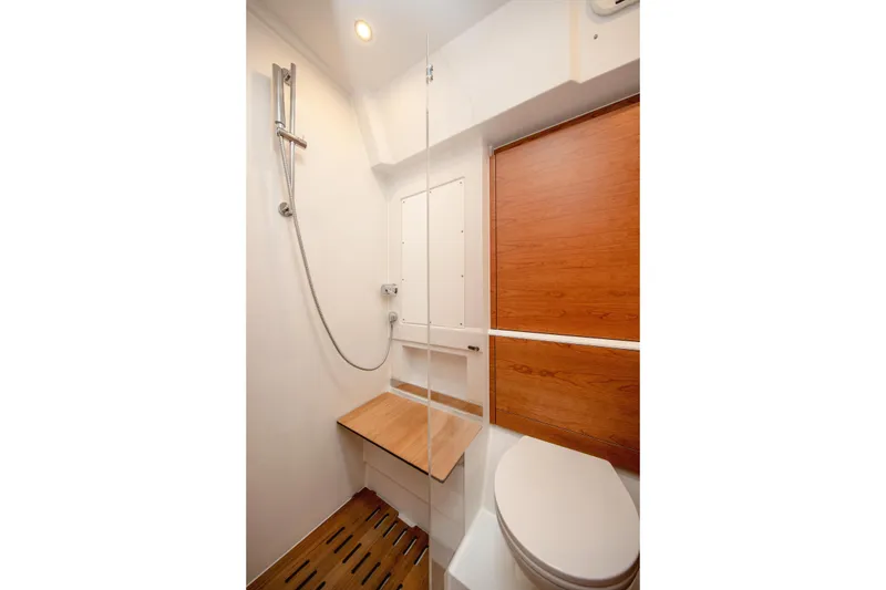 Slide: The Image of Modern bathroom interior of 2026 Hanse 590 yacht with wooden accents and sleek design. - 17