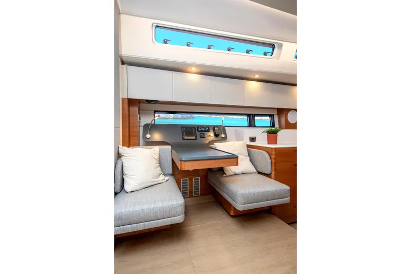 Slide: The Image of Luxurious interior of 2026 Hanse 590 yacht with modern seating and elegant decor. - 18