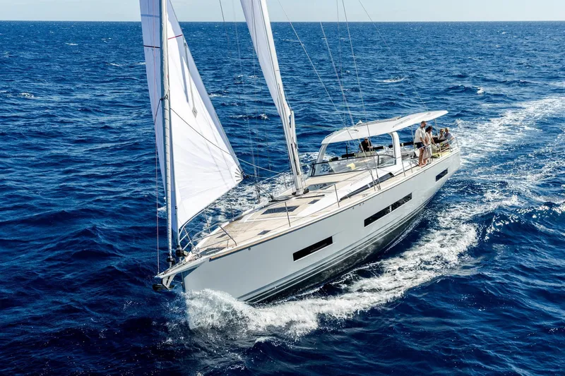 Slide: The Image of Sailing the ocean, 2026 Hanse 590 yacht glides smoothly under clear skies. - 35