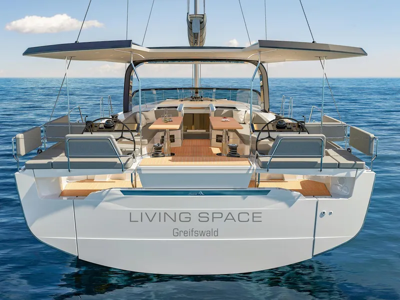 Slide: The Image of Modern 2025 Hanse 590 yacht on open sea, featuring spacious deck and sleek design. - 36